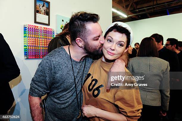 Davey Detail and Rose McGowan attend the 8th Annual Pieces of Heaven Art Auction Presented by Samsung Galaxy at MAMA Gallery on February 17, 2015 in...