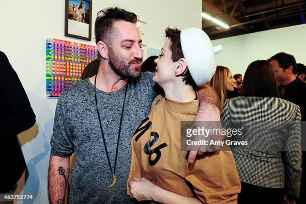 Davey Detail and Rose McGowan attend the 8th Annual Pieces of Heaven Art Auction Presented by Samsung Galaxy at MAMA Gallery on February 17, 2015 in...