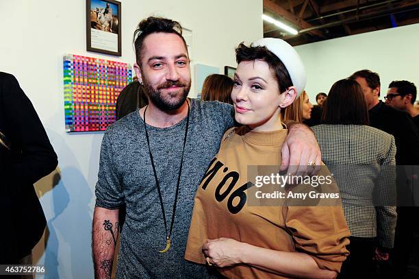 Davey Detail and Rose McGowan attend the 8th Annual Pieces of Heaven Art Auction Presented by Samsung Galaxy at MAMA Gallery on February 17, 2015 in...