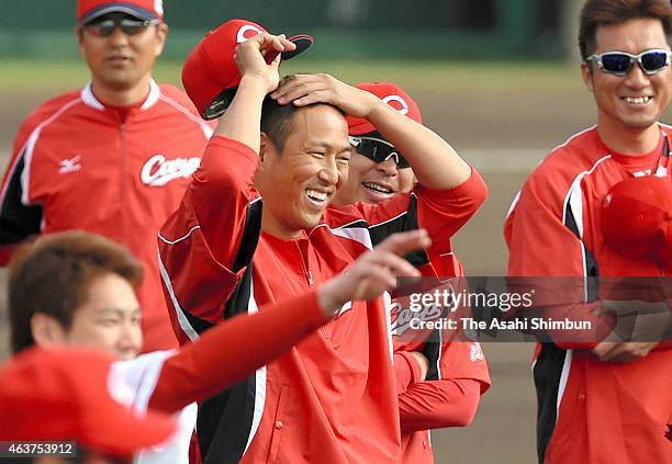 Hiroki Kuroda of Hiroshima Toyo Carp smiles during the spring camp at the Koza Shinkin Stadium on February 18, 2015 in Okinawa, Japan. Kuroda's...
