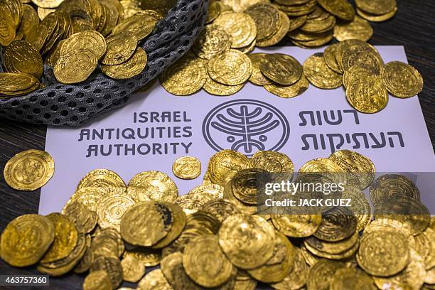 Picture shows some of the gold coins recently found on the seabed off Israel's Mediterranean coast, in the Israeli town of Caesarea, on February 18,...