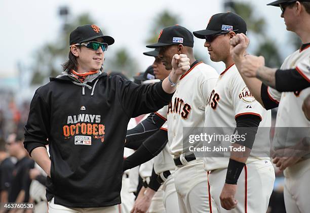 Tim Lincecum of the San Francisco Giants is greeted by teammates during player introductions before Game 3 of the NLCS against the St. Louis...