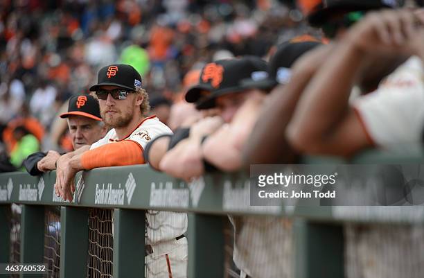 Hunter Pence of the San Francisco Giants looks on from the dugout before Game 3 of the NLCS against the St. Louis Cardinals at AT&T Park on Tuesday,...