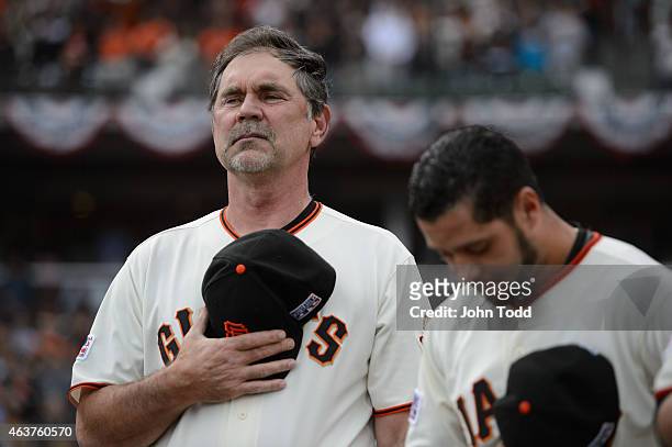 Bruce Bochy of the San Francisco Giants looks on during the National Anthem before Game 3 of the NLCS against the St. Louis Cardinals at AT&T Park on...
