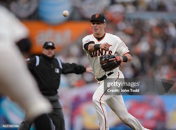 Joe Panik of the San Francisco Giants throws to first base during Game 3 of the NLCS against the St. Louis Cardinals at AT&T Park on Tuesday, October...