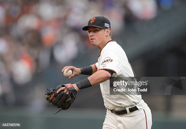 Joe Panik of the San Francisco Giants throws to first base during Game 3 of the NLCS against the St. Louis Cardinals at AT&T Park on Tuesday, October...