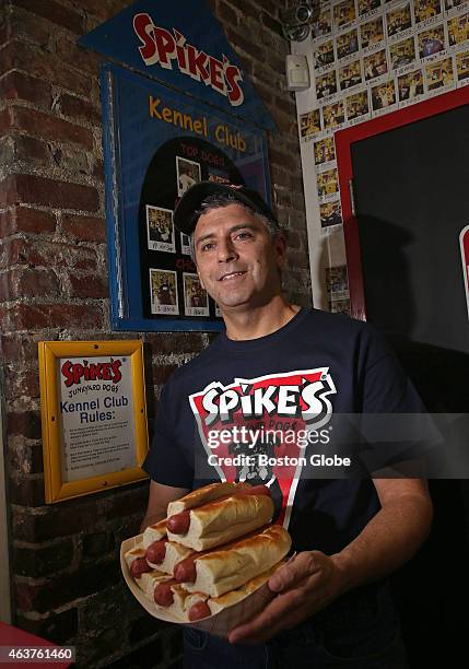 At Spike's Junkyard Dogs, owner Dave Gettleman holding the Kennel Club challenge which must be eaten within an hour and a half to warrant inclusion...
