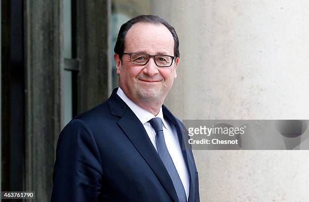 French President Francois Hollande waits prior a meeting with Francophonie General-Secretary Michaelle at the Elysee Palace on February 18, 2015 in...