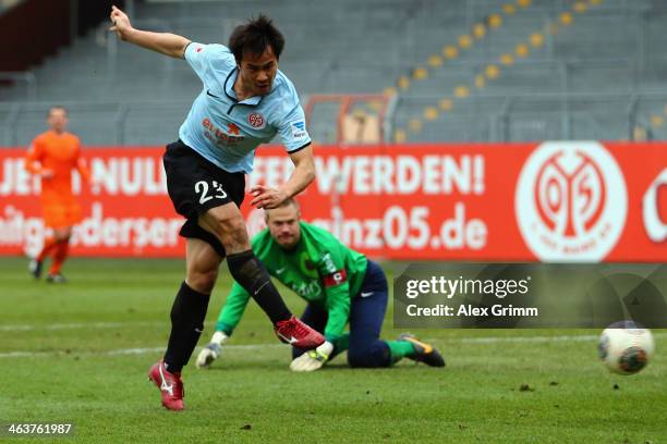 Shinji Okazaki of Mainz scores his team's third goal against goalkeeper Timo Ochs of Saarbruecken during the friendly match between 1. FSV Mainz 05...