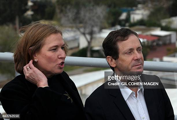Israeli Labour Party leader Isaac Herzog and former justice minister and Hatnuah party leader Tzipi Livni look out over Gaza Strip from the southern...