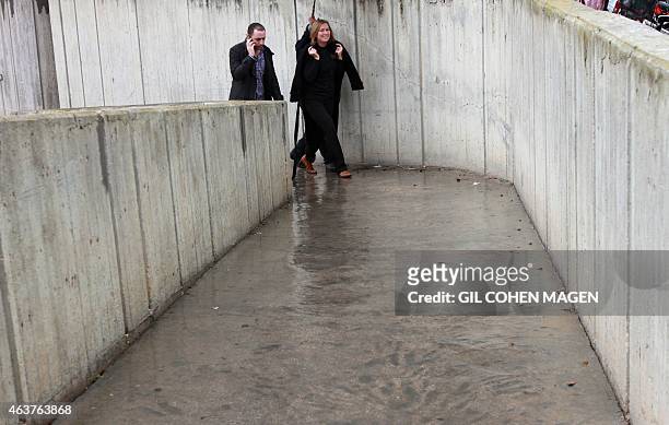 Former Israeli justice minister and Hatnuah party leader Tzipi Livni walks in the southern Israeli Kibbutz Beeri during an election campaign, on...