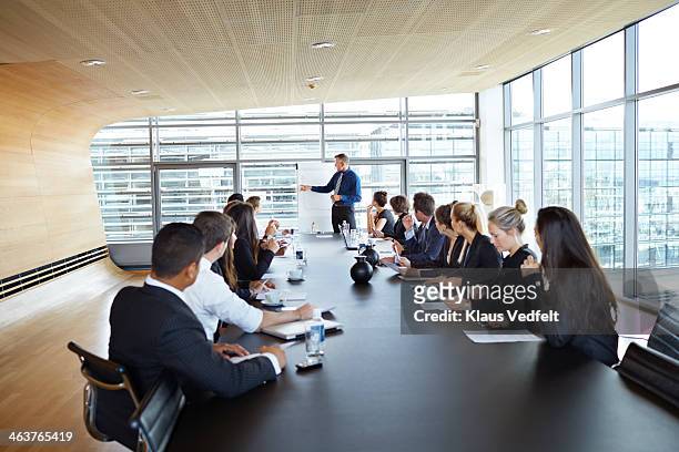 big business presentation with flip board - board room stock pictures, royalty-free photos & images