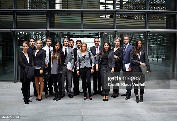 group shot of business people outside corporation - formal portrait stock-fotos und bilder