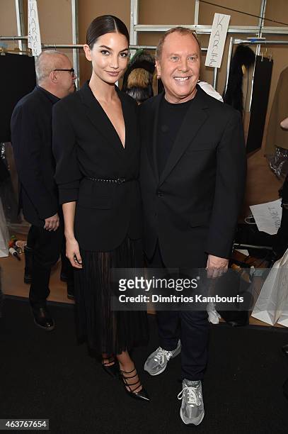Lily Aldridge and designer Michael Kors pose backstage at the Michael Kors fashion show during Mercedes-Benz Fashion Week Fall 2015 at Spring Studios...