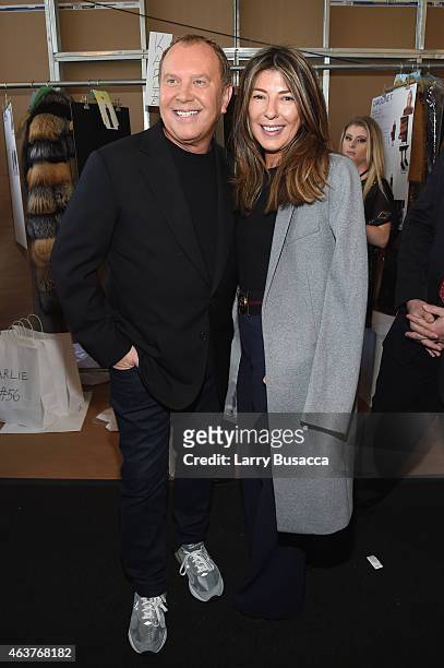 Designer Michael Kors and Nina Garcia pose backstage at the Michael Kors fashion show during Mercedes-Benz Fashion Week Fall 2015 at Spring Studios...