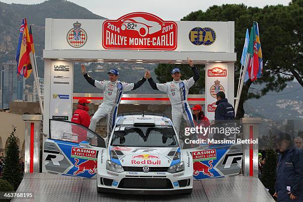 Sebastien Ogier of France and Julien Ingrassia of France celebrate their victory in the final podium during Day Four of the WRC Monte-Carlo on...