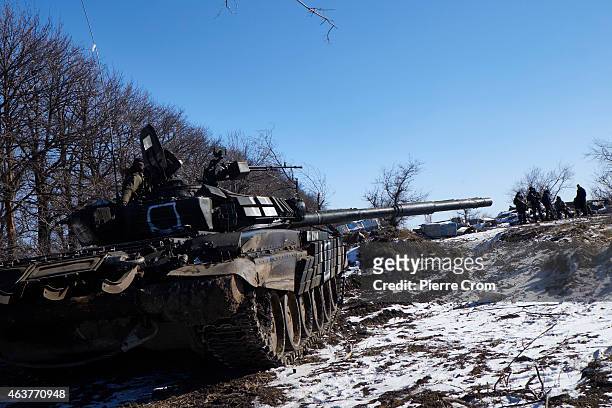 Pro-Russian rebels take position on the road to Debaltseve on February 18 near Vuglegirsk, Ukraine. Ukrainian troops have been forced to retreat from...