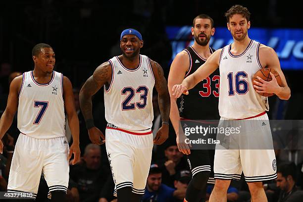 LeBron James of the Cleveland Cavaliers and the Eastern Conference reacts with Kyle Lowry of the Toronto Raptors and the Eastern Conference and Pau...