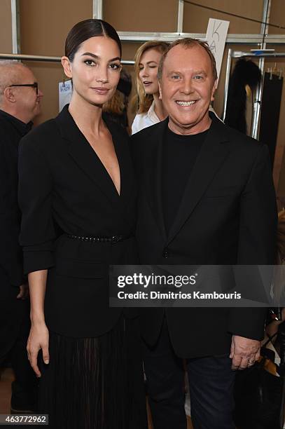 Lily Aldridge and designer Michael Kors pose backstage at the Michael Kors fashion show during Mercedes-Benz Fashion Week Fall 2015 at Spring Studios...