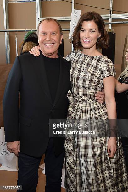 Designer Michael Kors and Hanneli Mustaparta pose backstage at the Michael Kors fashion show during Mercedes-Benz Fashion Week Fall 2015 at Spring...