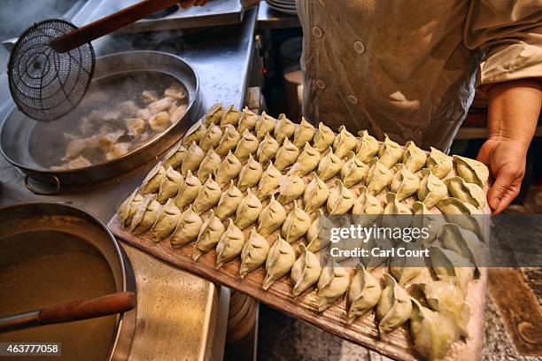 Chef prepares dumplings in a restaurant in China Town on February 18, 2015 in London, England. Chinese New Year 2015 , the Year of the Sheep, will be...