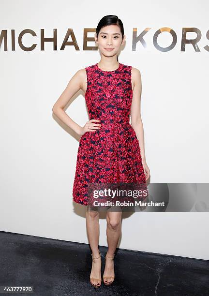 Ming Xi attends Michael Kors at Spring Studios on February 18, 2015 in New York City.