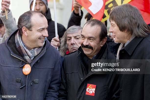 Secretary General of CFDT Laurent Berger speaks with newly elected CGT Secretary General Philippe Martinez and his predecessor Bernard Thibault as...