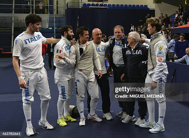 Italy's Giorgio Avola, Andrea Baldini, Andrea Cassara and Valerio Aspromonte and coach Andrea Cipressa and part of the staff celebrate after beating...