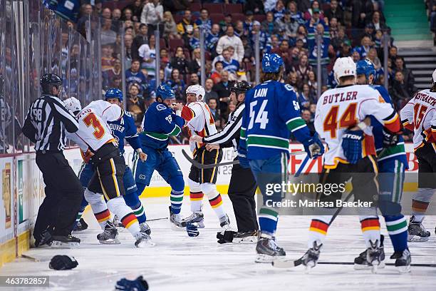 At the opening face off between the Vancouver Canucks and the Calgary Flames, both teams lines drop the gloves. Kevin Bieksa of the Vancouver Canucks...