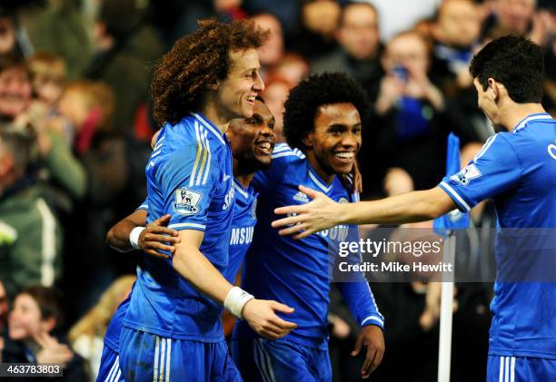 Samuel Eto'o of Chelsea celebrates with teammates David Luiz , Willian and Oscar after scoring his team's third goal and completing his hat trick...