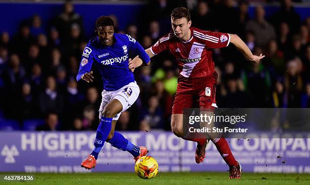 Birmingham forward Demarai Gray is challenged by Middlesbrough defender Ben Gibson during the Sky Bet Championship match between Birmingham City and...