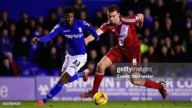 Birmingham forward Demarai Gray is challenged by Middlesbrough defender Ben Gibson during the Sky Bet Championship match between Birmingham City and...