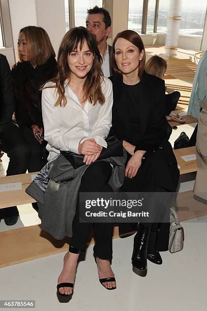 Actresses Dakota Johnson and Jullianne Moore attend the Boss Womens fashion show during Mercedes-Benz Fashion Week Fall 2015 on February 18, 2015 in...