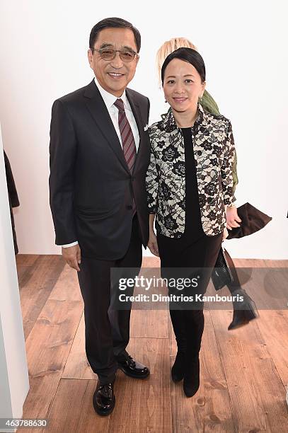 Celia Chou and Silas Chou are seen backstage at the Michael Kors fashion show during Mercedes-Benz Fashion Week Fall 2015 at Spring Studios on...