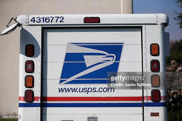 Postal Service mail truck sits in a parking lot at a mail distribution center on February 18, 2015 in San Francisco, California. The Postal Service...