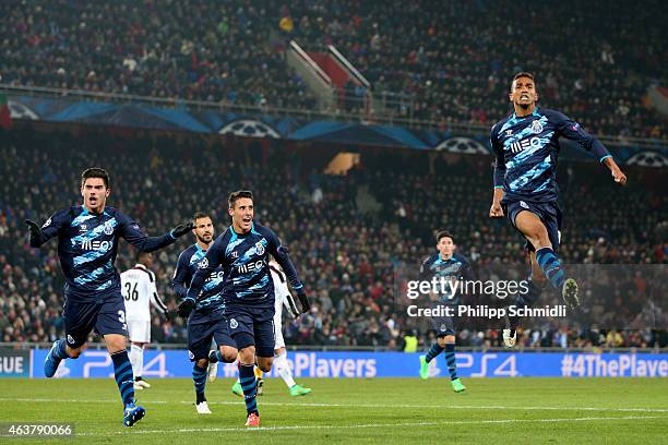 Danilo of FC Porto celebrates with teammates after scoring his team's first goal during the UEFA Champions League Round of 16 match between FC Basel...