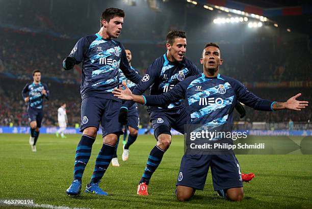 Danilo of FC Porto celebrates with teammates after scoring his team's first goal during the UEFA Champions League Round of 16 match between FC Basel...