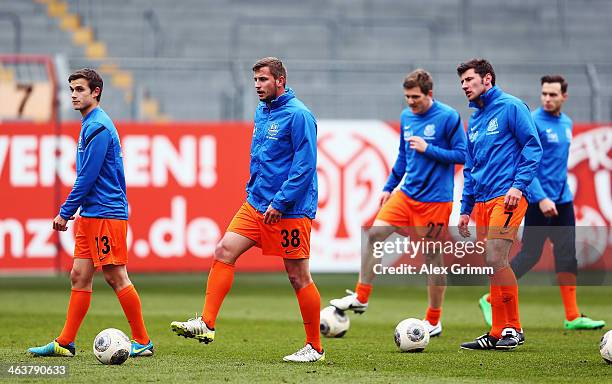 Raffael Korte, Marcel Ziemer, Lukas Kohler and Stefan Reisinger of Saarbruecken warm up for the friendly match between 1. FSV Mainz 05 and 1. FC...