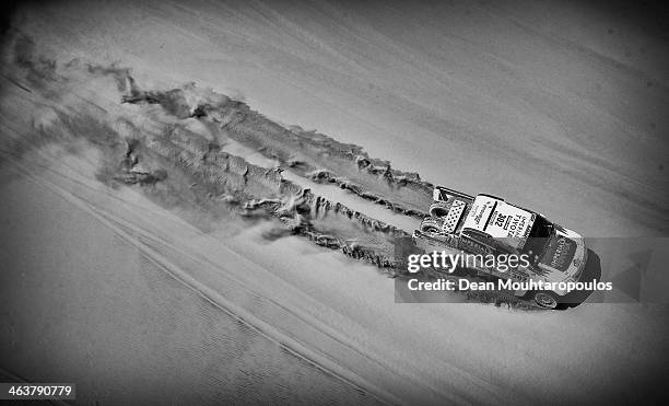 Giniel De Villiers of South Africa and Dirk Von Zitzewitz of Germany for Imperial Toyota compete in stage 12 on the way to La Serena during Day 13 of...