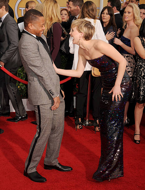Actors Cuba Gooding Jr. And Jennifer Lawrence arrive at the 20th Annual Screen Actors Guild Awards at The Shrine Auditorium on January 18, 2014 in...