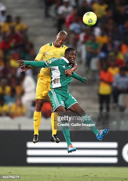 South African captain Benett Nthete and Ifeanyi Ede of Nigeria challenge for the header during the 2014 African Nations Championship match between...