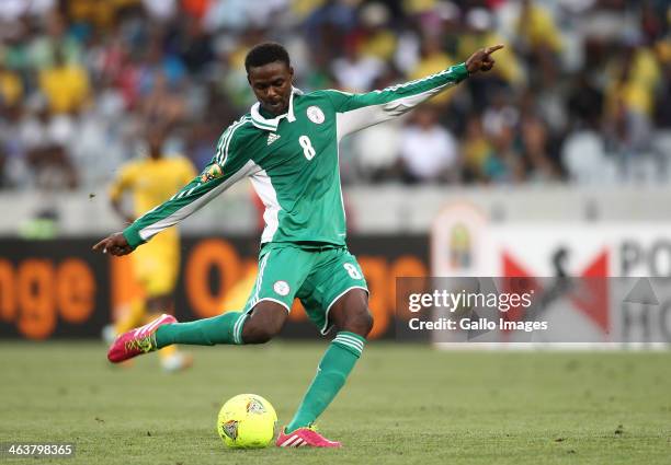 Rabiu Ali of Nigeria takes a shot at goal during the 2014 African Nations Championship match between South Africa and Nigeria at Cape Town Stadium on...