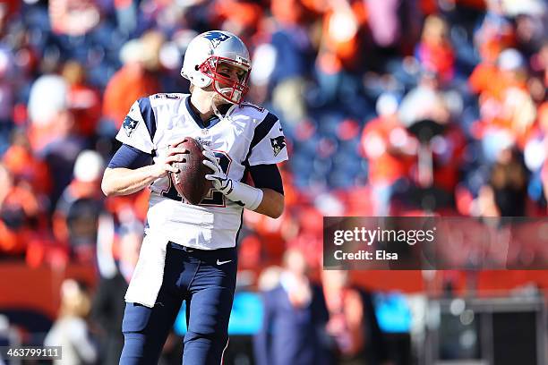 Tom Brady of the New England Patriots warms up prior to their AFC Championship game against the Denver Broncos at Sports Authority Field at Mile High...