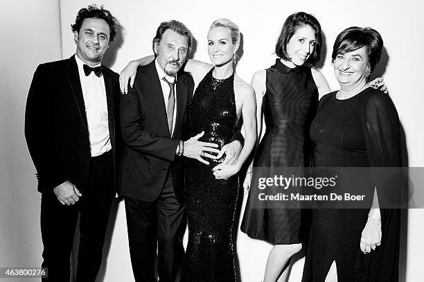 President and Chief Executive Officer for Lacoste North America Francis Pierrel, singer Johnny Hallyday, actress Laeticia Hallyday, Coco Pierrel, and...