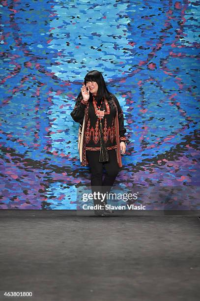 Designer Anna Sui poses on the runway at the Anna Sui fashion show during Mercedes-Benz Fashion Week Fall at The Theatre at Lincoln Center on...