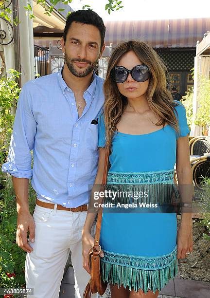 Noah Mills and Erica Pelosini attend the Maison De Mode Oscar week lunch hosted by Rosario Dawson, Amanda Hearst, Hassan Pierre & Spotify at Petit...