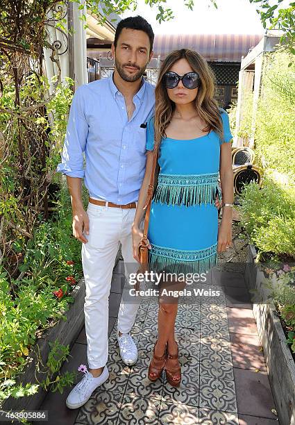 Noah Mills and Erica Pelosini attend the Maison De Mode Oscar week lunch hosted by Rosario Dawson, Amanda Hearst, Hassan Pierre & Spotify at Petit...