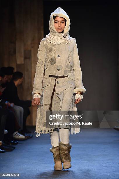 Model walks the runway during the Greg Lauren fashion show during Mercedes-Benz Fashion Week Fall 2015 at ArtBeam on February 18, 2015 in New York...