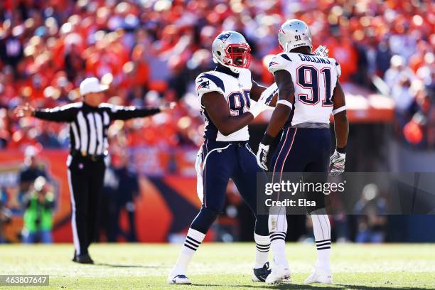 Chandler Jones celebrates with Jamie Collins of the New England Patriots after breaking up a pass in the first quarter against the Denver Broncos...