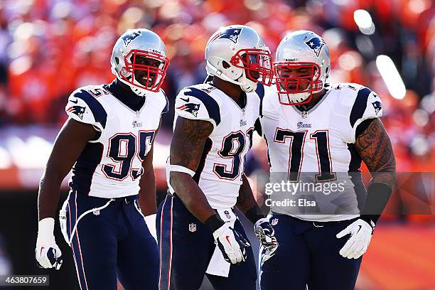 Chandler Jones celebrates with Sealver Siliga and Jamie Collins of the New England Patriots after breaking up a pass in the first quarter against the...